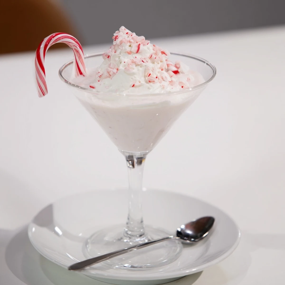 Creamy, layered Peppermint Twist cocktail, a delightful blend of chocolate and peppermint flavors.