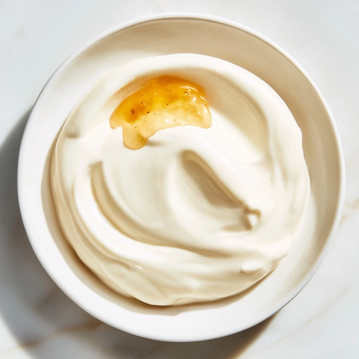 A close-up view of creamy yogurt, perfect for breakfast with fresh berries.