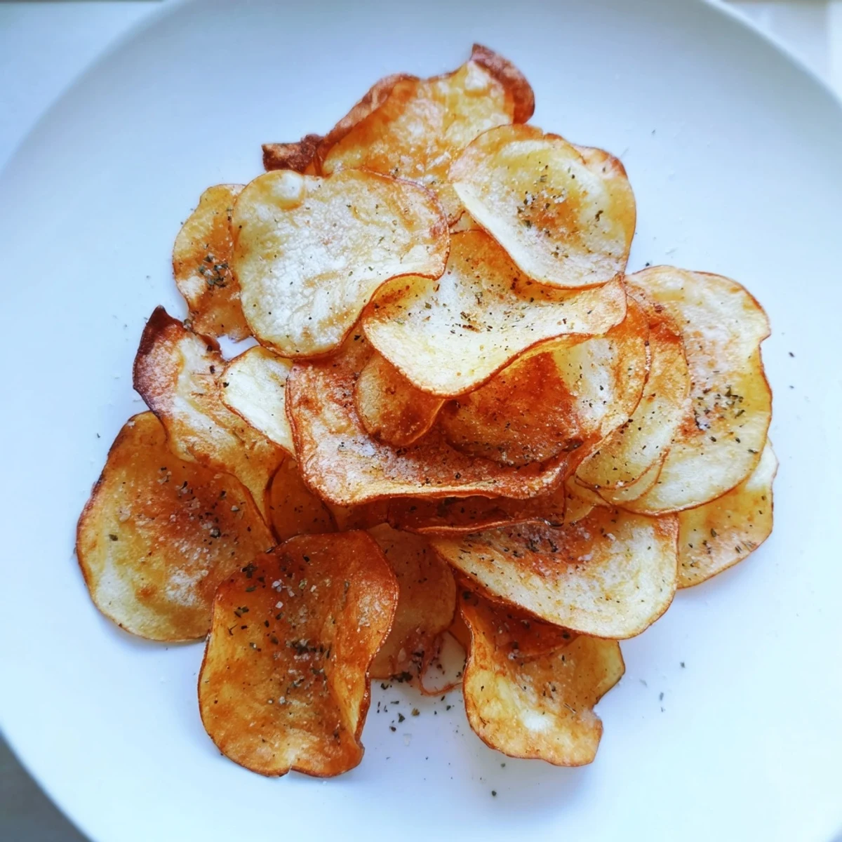 Golden Crispy Chip slices, perfectly seasoned and baked until crispy; a delicious homemade treat to enjoy.