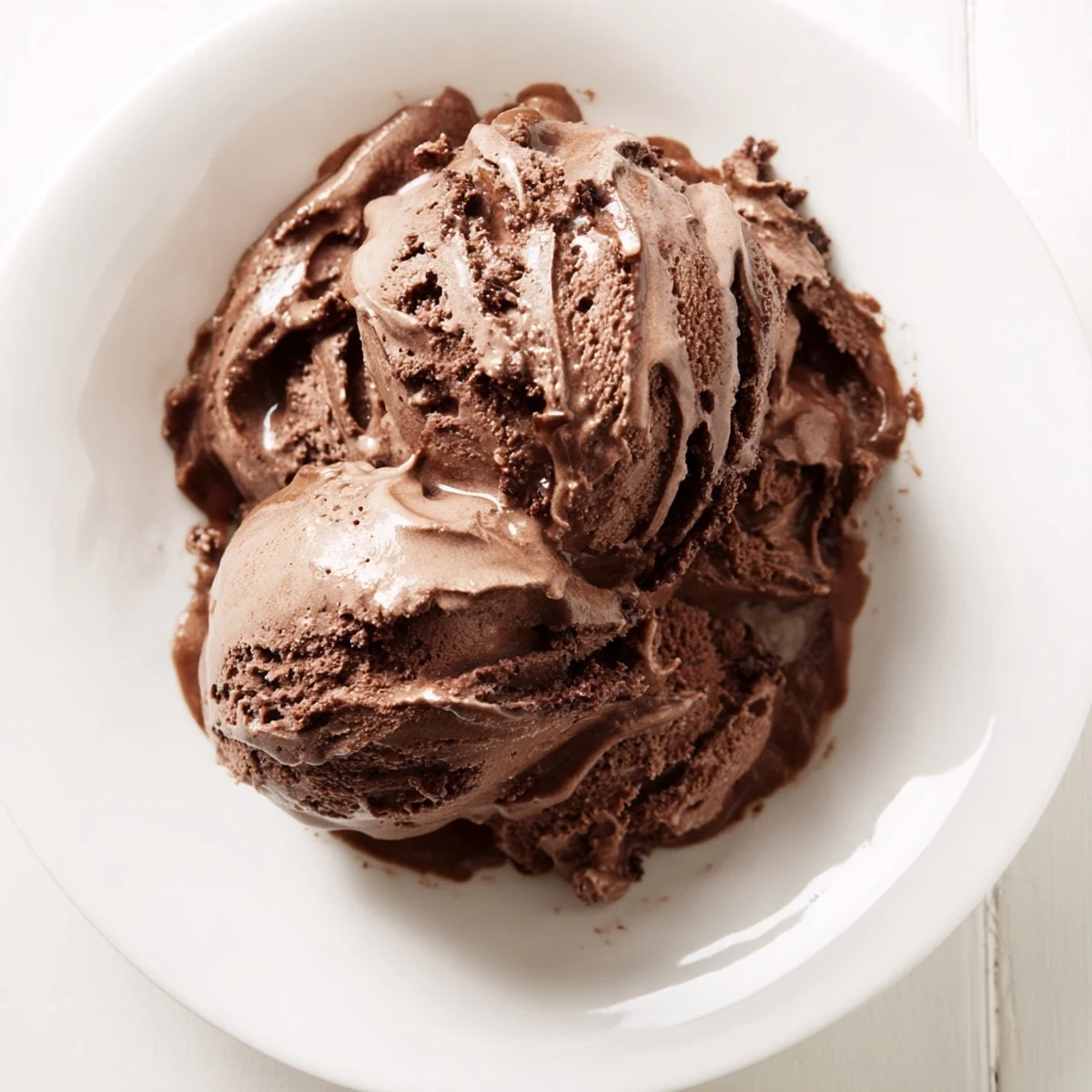 A scoop of decadent chocolate ice cream, ready to enjoy after a perfect churning and freezing process.