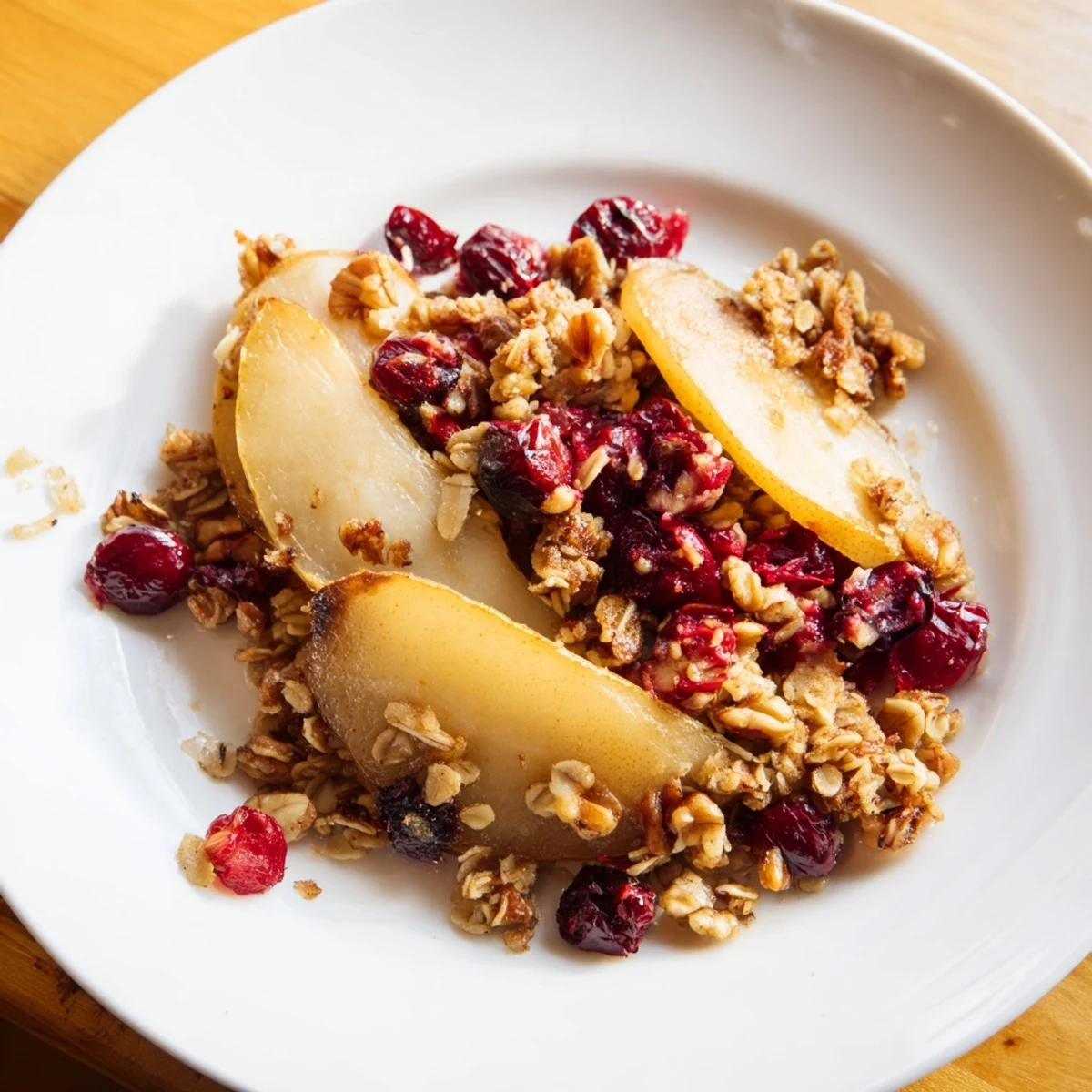 A warm Spiced Pear and Cranberry Crisp, bubbling with juicy fruit and golden oat topping.