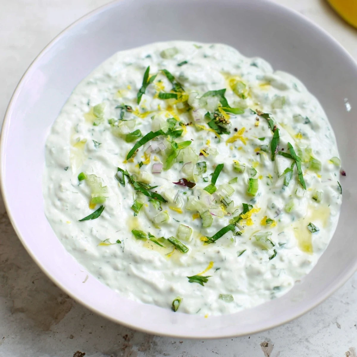 Creamy Greek Yogurt Dip, a smooth and vibrant appetizer with fresh herbs ready to be served.