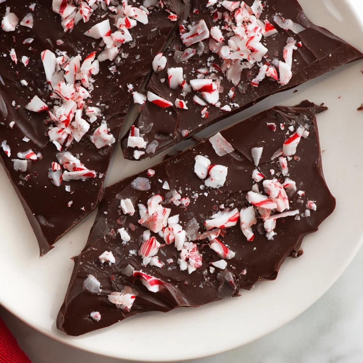 Festive Peppermint Chocolate, a close-up showing the layers of dark chocolate and bright peppermint.
