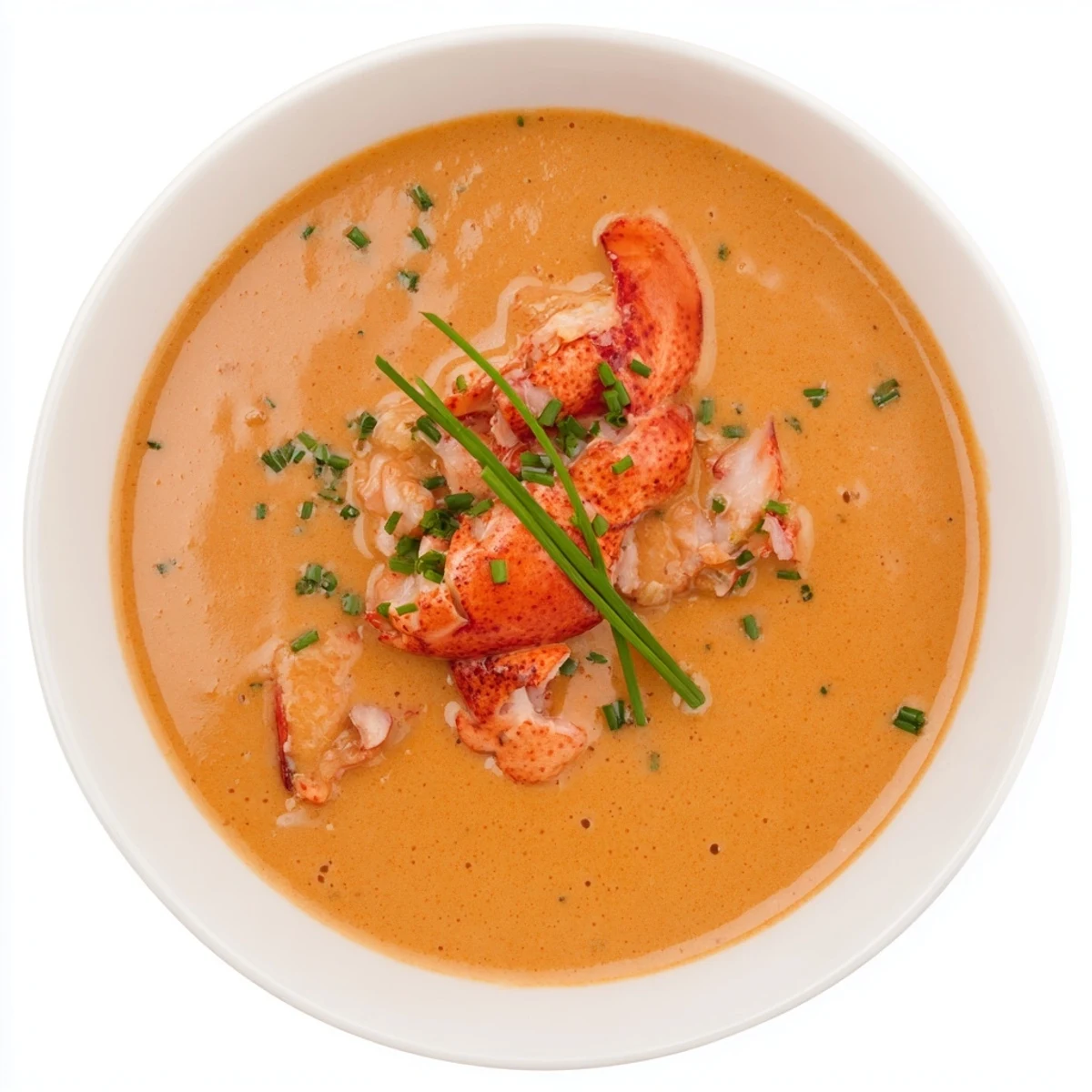 Creamy Romantic Lobster Bisque with Sherry Vinegar in an elegant white bowl, garnished with chives