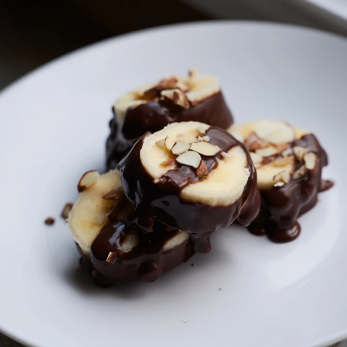 Decadent Chocolate Covered Banana Bites with creamy banana centers and dark chocolate, ready to enjoy.