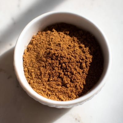 Ground cinnamon, ginger, cloves—a vibrant photo showcasing the gingerbread spice mix ready for your recipes.